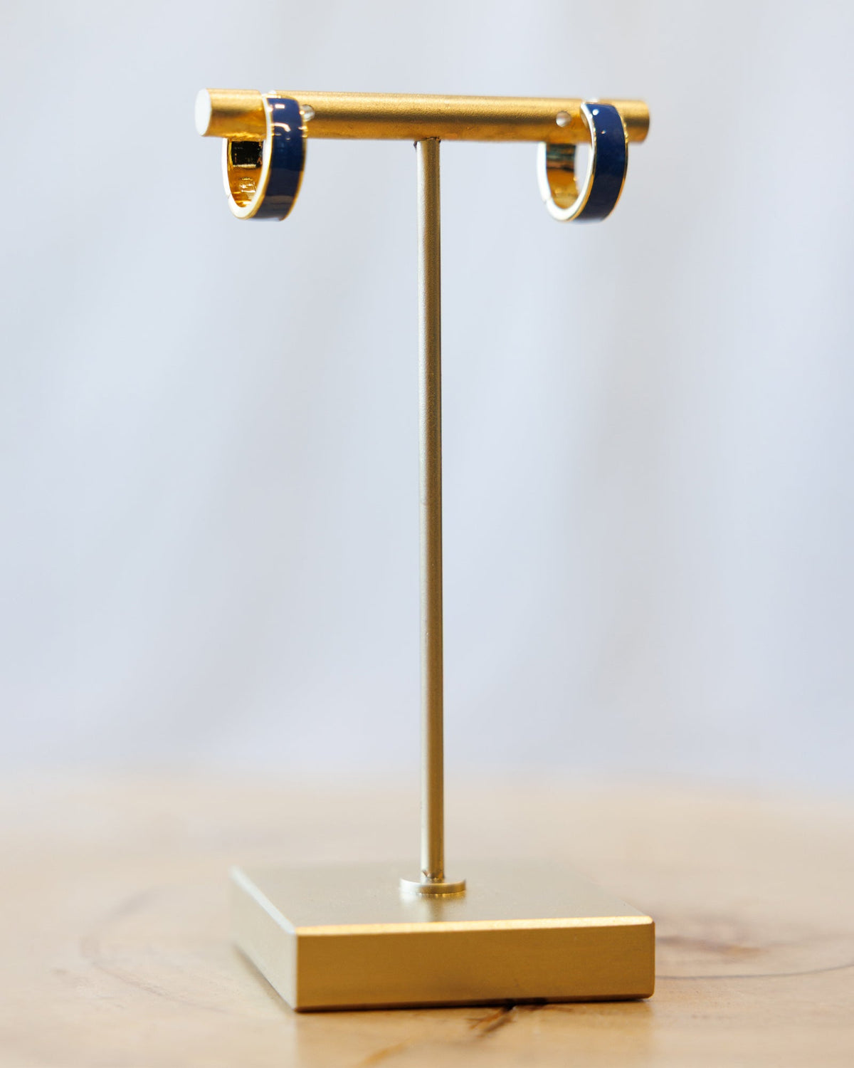 Downeast Blue Moon Huggie Hoop Earrings in silver with a blue moon charm, small and stylish for everyday wear.
