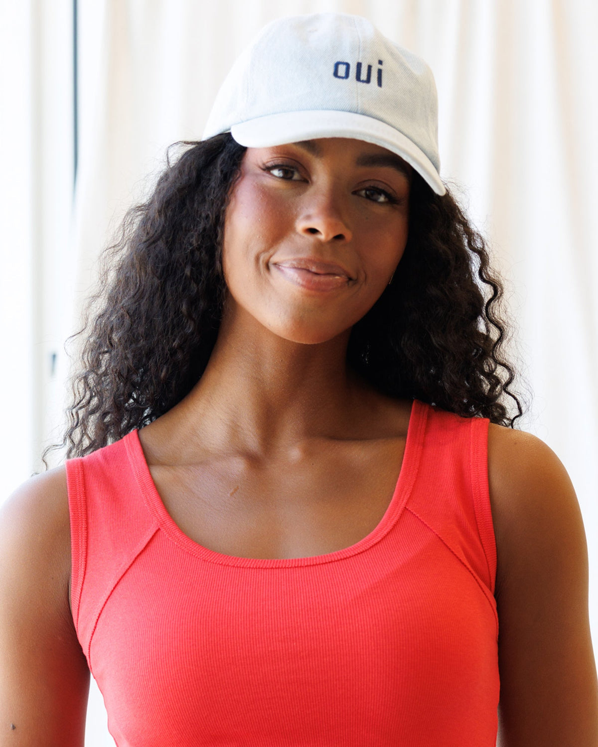 Downeast Say Oui hat, stylish beige hat with embroidered "Say Oui" text, casual accessory for sunny days.