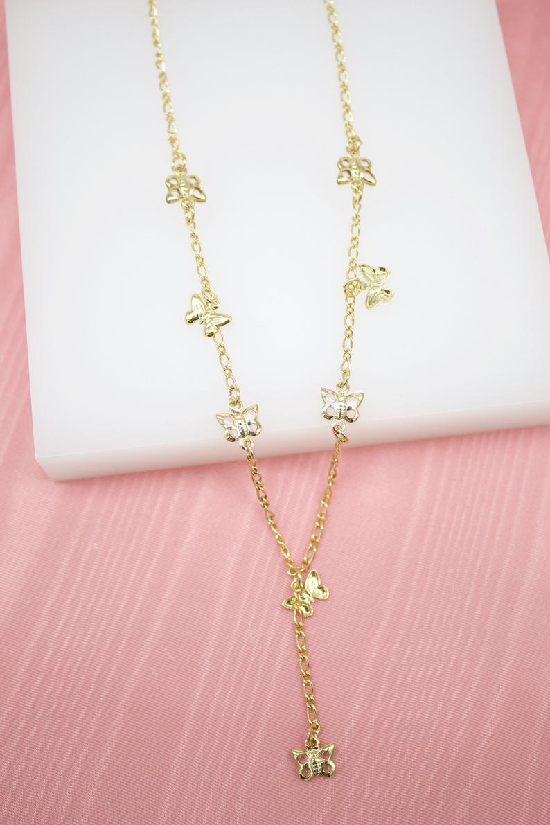 MIA Jewelry butterfly dangle charms layered necklace featuring delicate butterfly pendants and multiple chain layers.