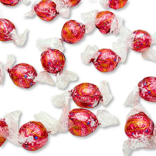 Lindt LINDOR Birthday Cake White Chocolate Truffles in bulk, showcasing creamy white chocolates with birthday cake flavor from Candy In Bulk