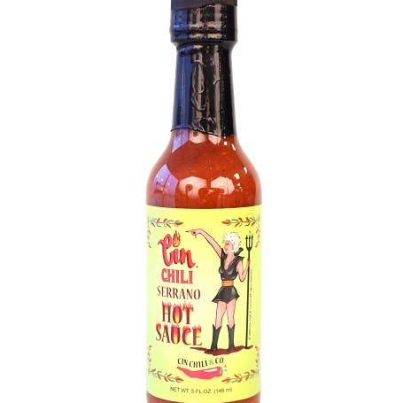 Cinderosa Ranch Cin Chili Serrano Hot Sauce bottle with bright label, showcasing spicy hot sauce for enhancing dishes.
