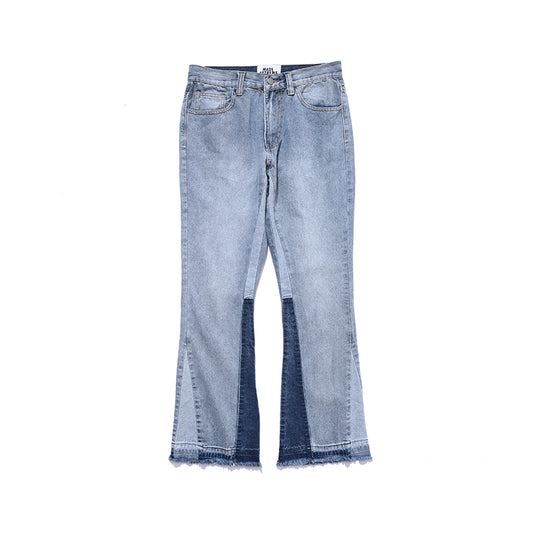 BackUpMyFileSnow® patchwork drop jeans with distressed denim and colorful patch accents, styled for a casual look.