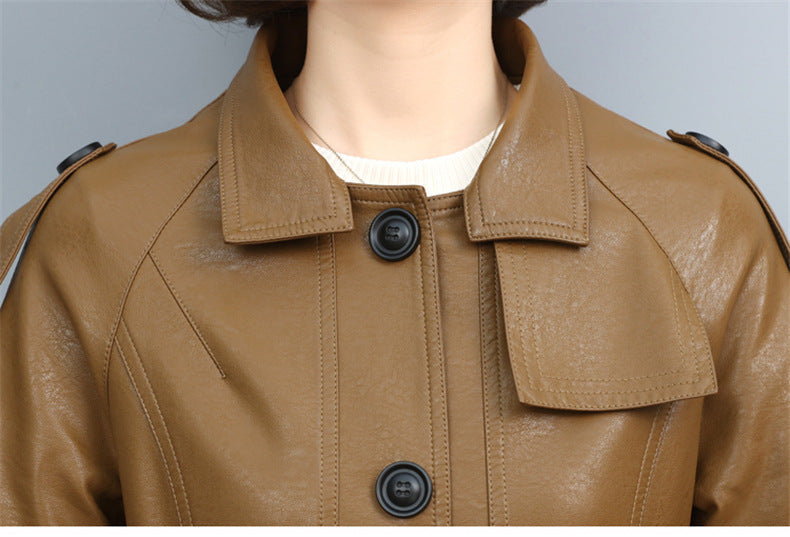 Women's leather trench coat with turn-down collar, drawstring waist, and long loose silhouette in solid color