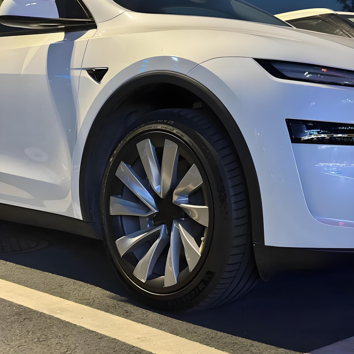 Set of four 20-inch wheel rim protectors for Tesla Model Y Juniper, designed to shield rims from damage.