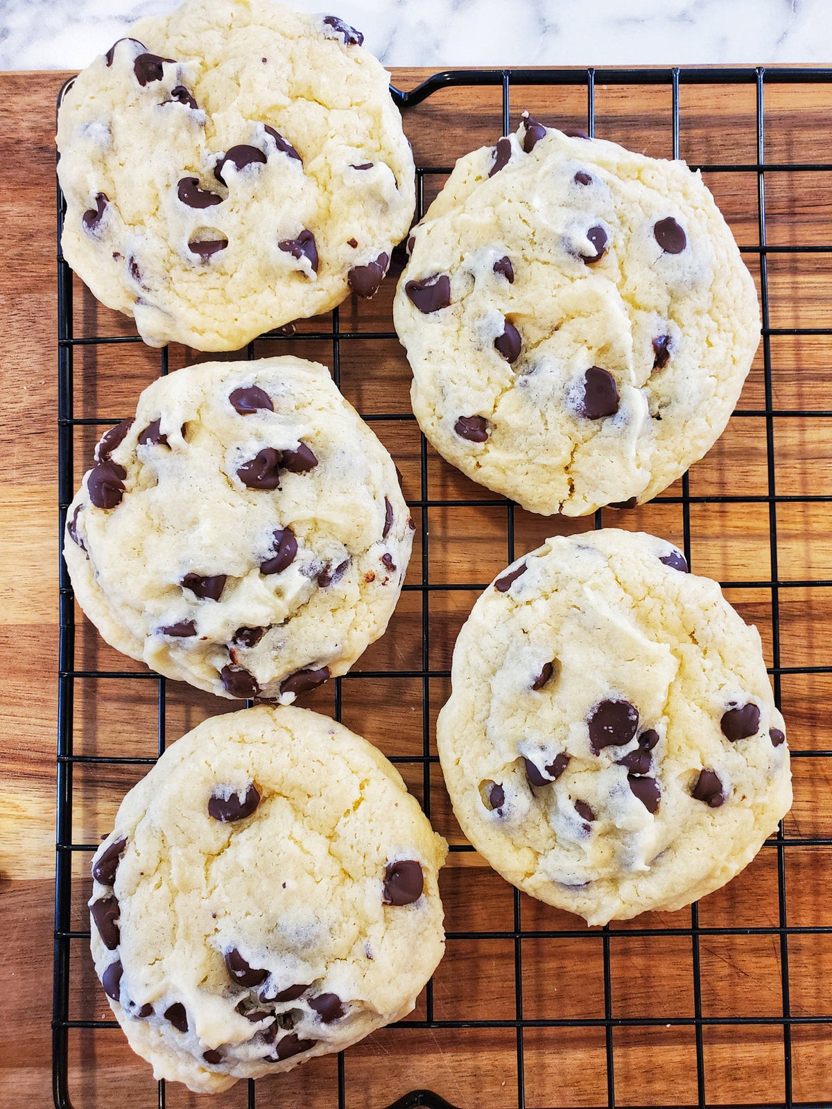 Assorted chocolate chip cookies from Let's Get Baked Artisan Desserts, crispy cookies with melted chocolate chips in a dozen batch.