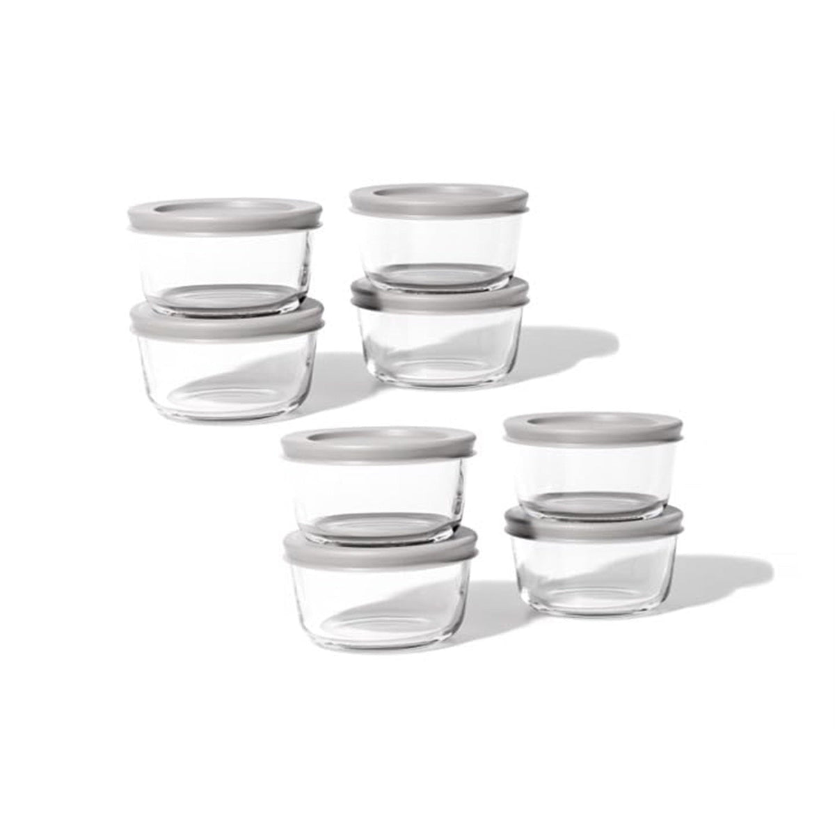 Set of 16 Dura Living round glass storage containers with grey lids, 7 oz capacity, ideal for kitchen organization and food storage.