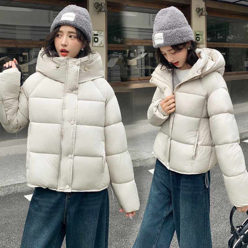 Women's stylish short down puffer coat in a sleek quilted design, front view