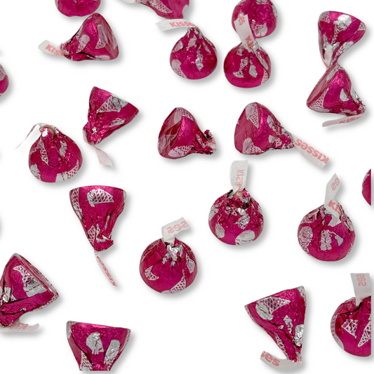 Hershey's Kisses strawberry ice cream cone flavored chocolates from Candy In Bulk, shown in a bulk value bag.