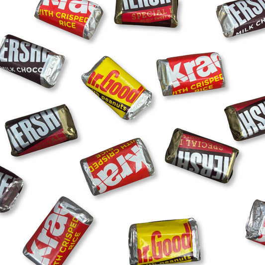 Assorted Hershey's Miniatures chocolate candy bars in a bulk value bag, including various classic chocolate flavors from Candy In Bulk.