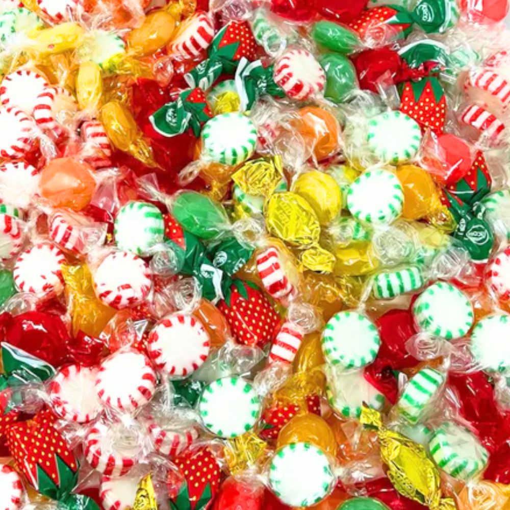Assorted hard candy mix from Candy In Bulk in a large bulk bag, colorful candies with various shapes and flavors.