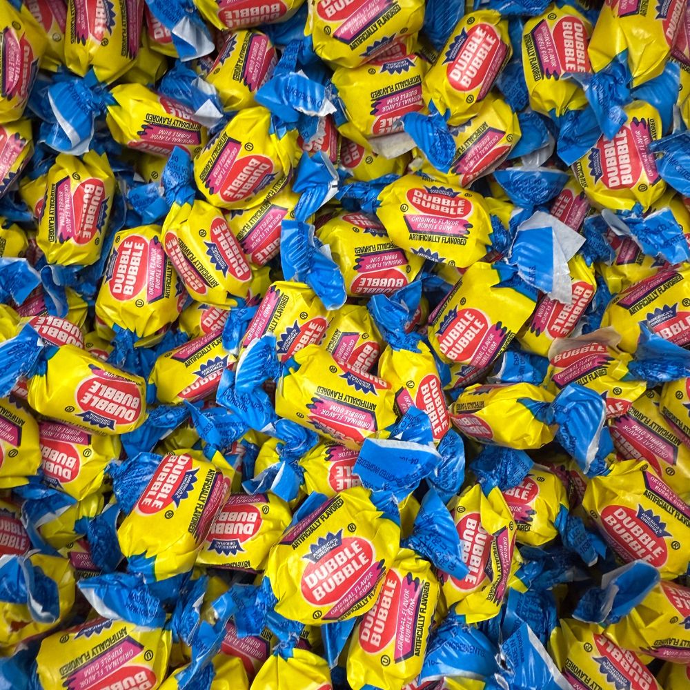 Dubble Bubble Original Chewing Gum in a bulk value bag by Candy In Bulk, featuring colorful gum pieces in a clear bag.