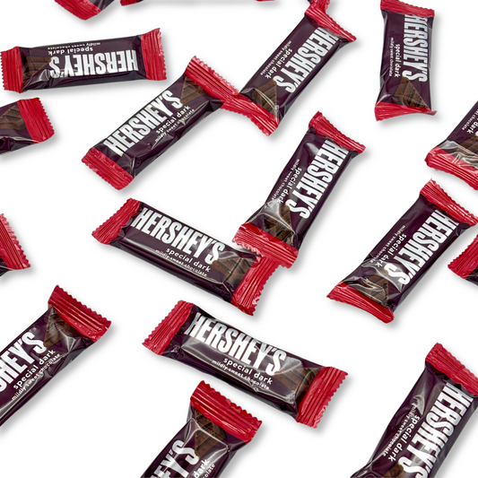 Two bags of Hershey's Special Dark Mildly Sweet Chocolate snack size candies from Candy In Bulk, showing the chocolate pieces inside.