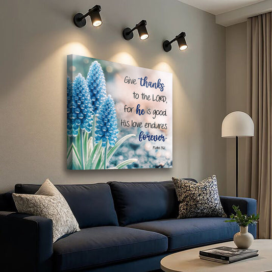 Canvas wall sign featuring Psalm 136:1 "Give Thanks To The Lord" with religious text in elegant font on a neutral background.