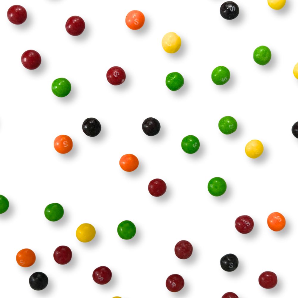 Colorful Skittles Original Fruit Candy in a bulk bag by Candy In Bulk, showing bright, assorted fruit-flavored candies.