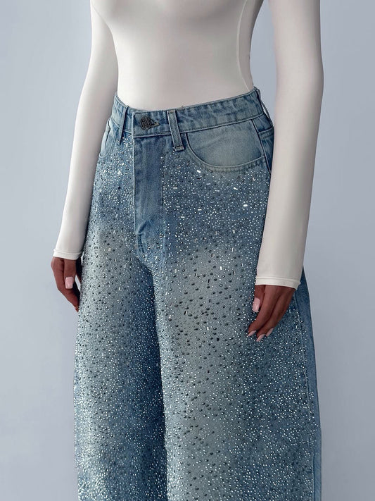 Irregular rhinestone jeans from Anybestbuy Store featuring distressed denim with scattered rhinestones and unique design details.