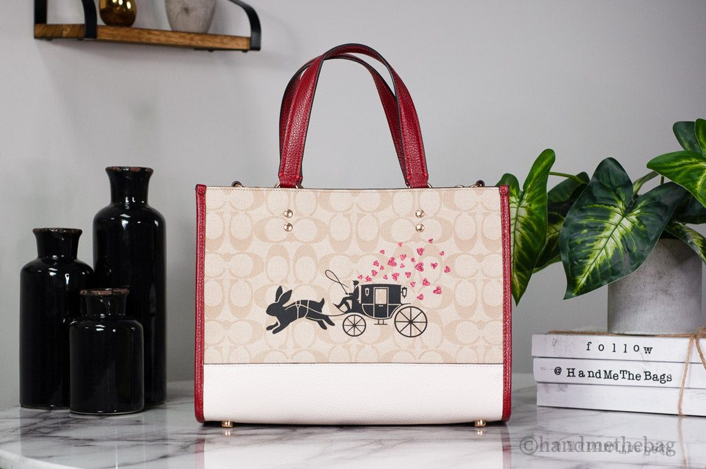 Coach Dempsey Medium Lunar New Year Rabbit Carryall Tote in leather with festive Lunar New Year design and spacious interior.