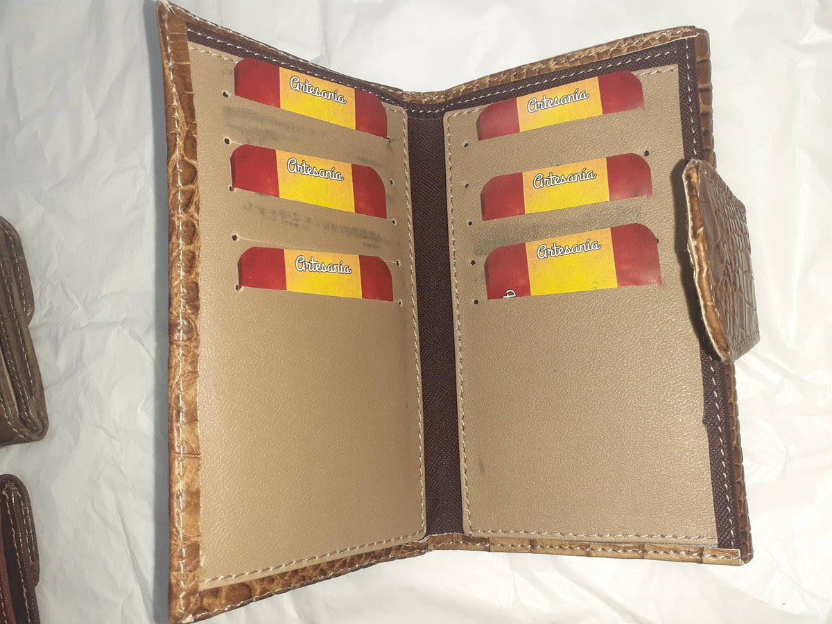 Handmade women's wallet with multiple card slots and a sleek leather design, showcasing craftsmanship and elegant style.