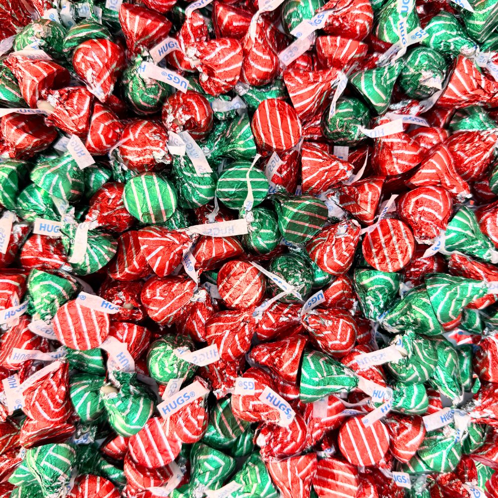 Hershey's Hugs milk chocolate kisses with white creme in a bulk Candy In Bulk package, showing three chocolate candies with white and milk coating.