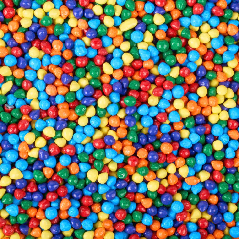 Rainbow chocolate drops by Candy In Bulk, colorful candy-coated chocolate pieces in a bulk bag, vibrant and sweet for snacking.