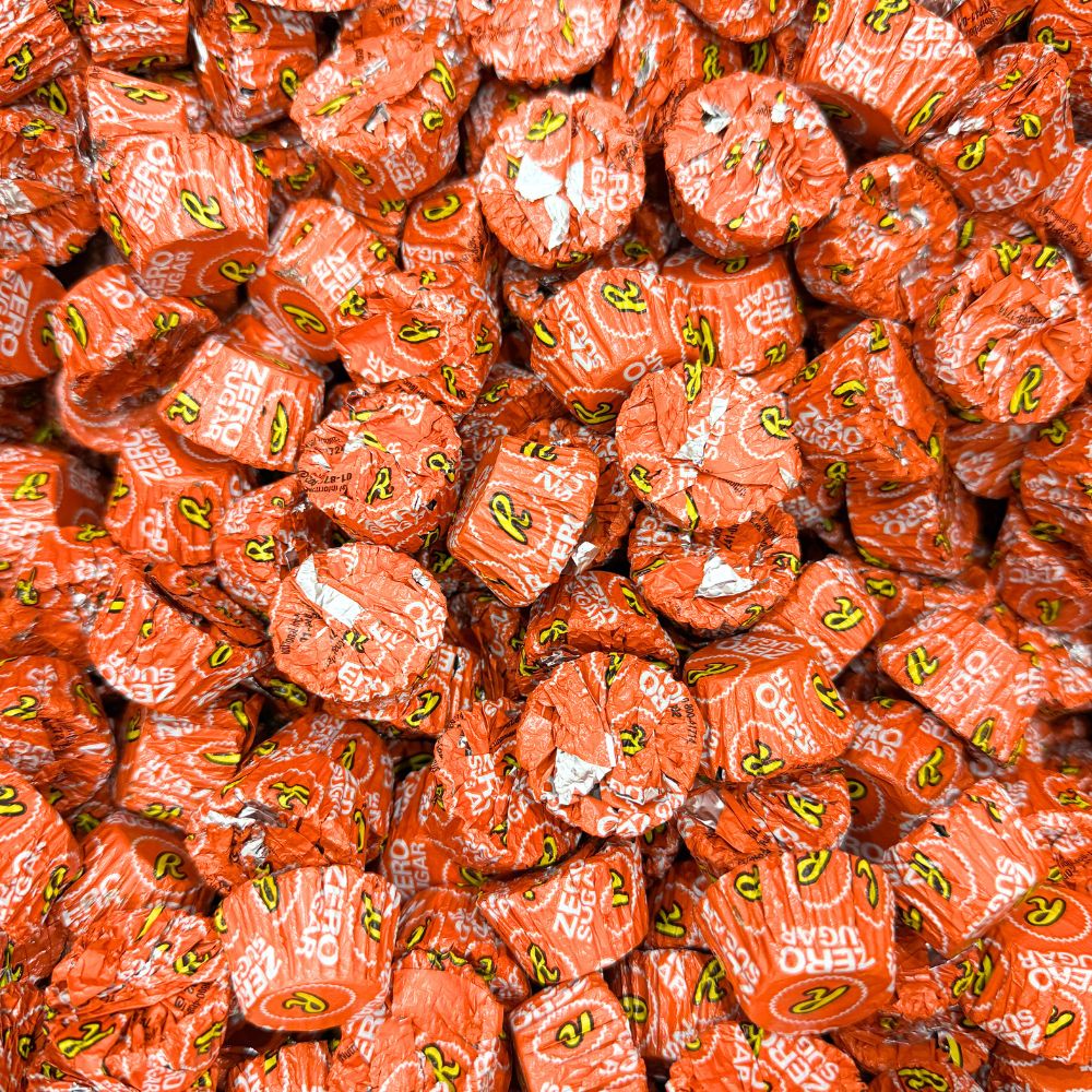 Assorted Reese’s Miniature Cups Zero Sugar Milk Chocolate and Peanut Butter candies in a bulk value bag, displayed in a close-up image.