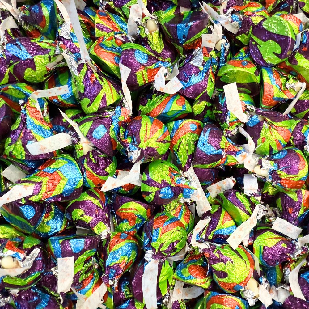 Hershey's Kisses Cinnamon Toast Crunch flavored chocolate candies in a bulk value bag, showing the shiny wrapped chocolates.