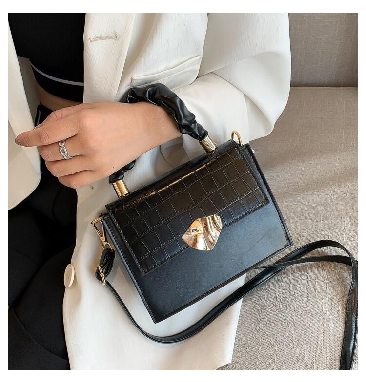 BACKUPMYFILESNOW® designer women's crossbody handbag with a stylish stone pattern and compact, sleek design.