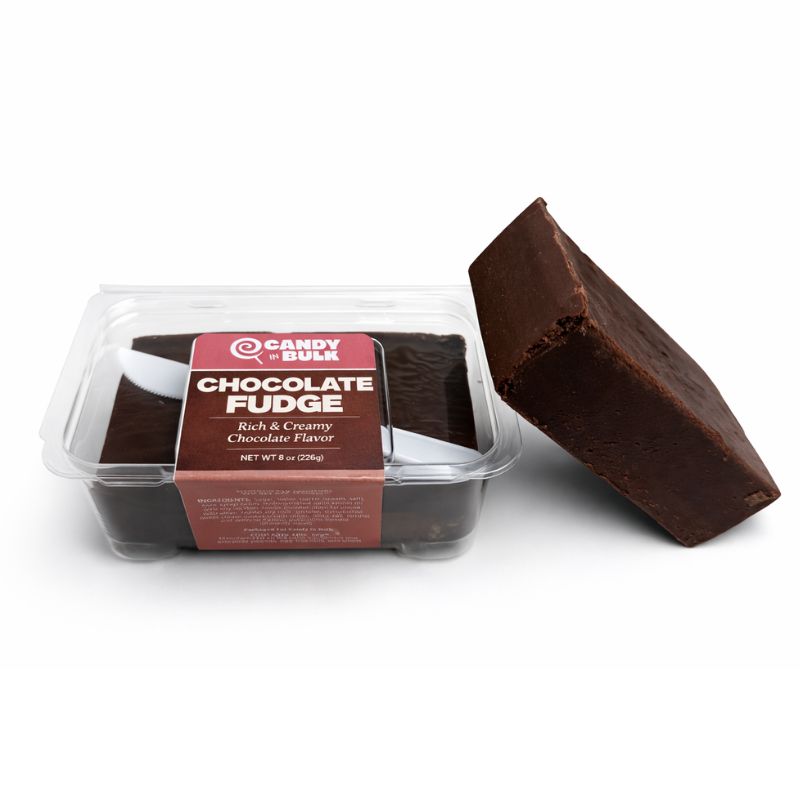 Assorted chocolate fudge squares from Candy In Bulk with smooth, rich chocolate texture and glossy finish on a white plate.