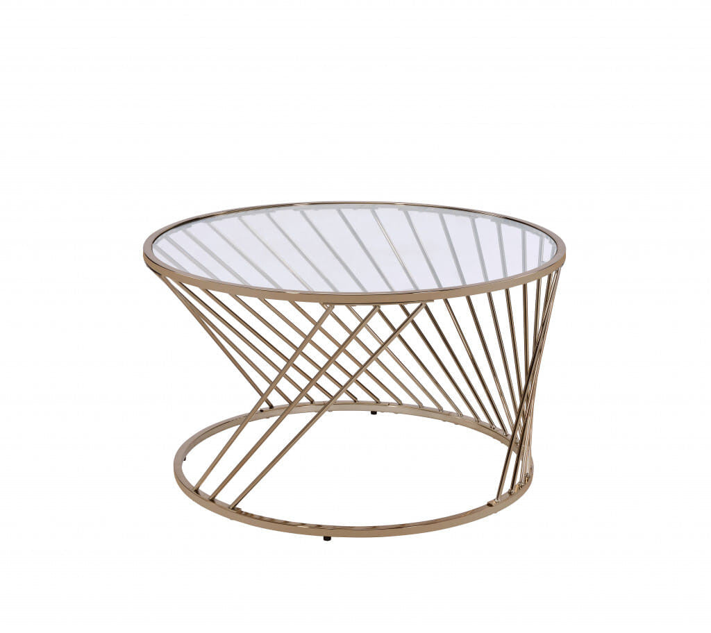 Round coffee table with champagne-tinted glass top, clear glass accents, and metal frame designed for modern living spaces.