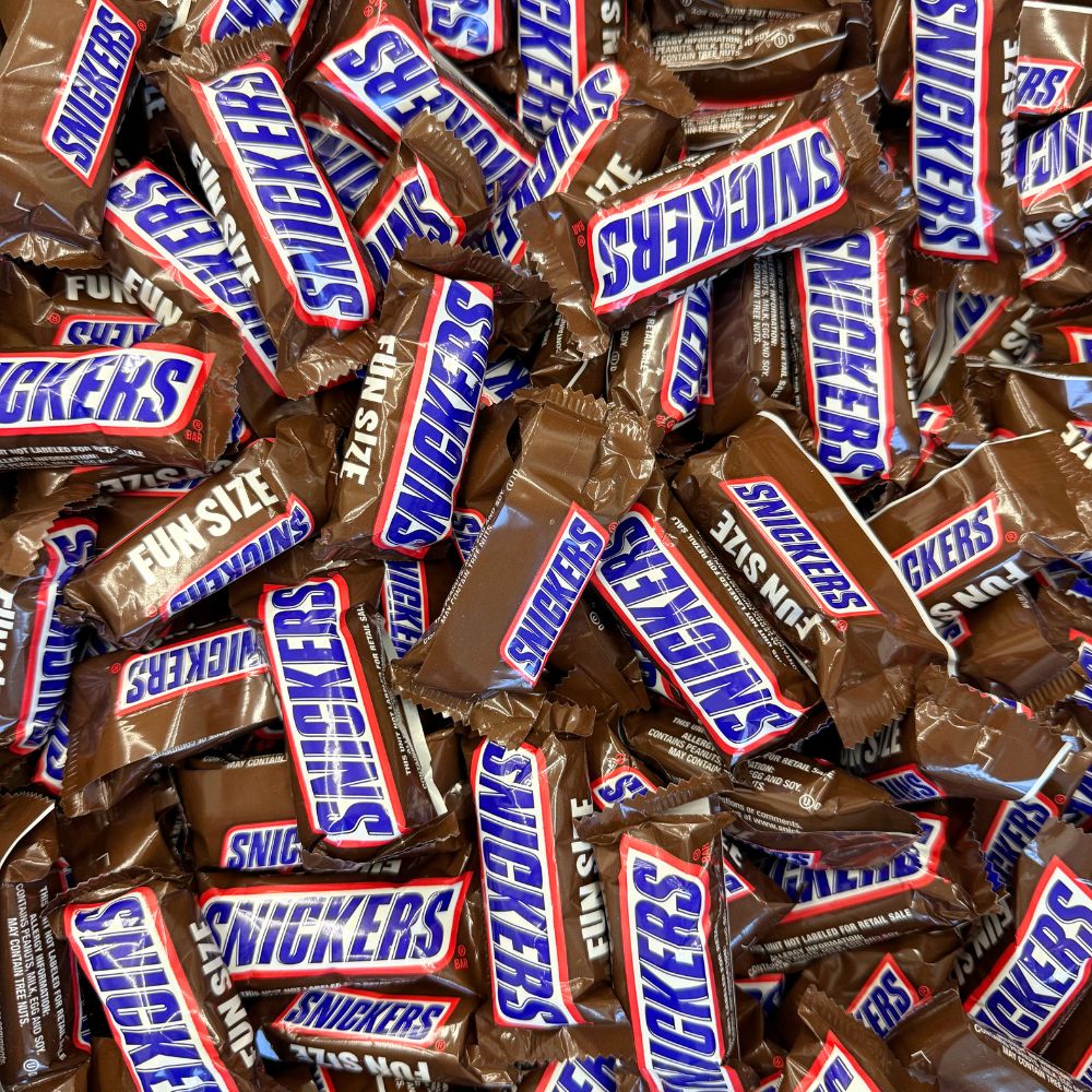 Fun size Snickers chocolate candy bars from Candy In Bulk, shown in a bulk value bag, perfect for snacking and sharing.
