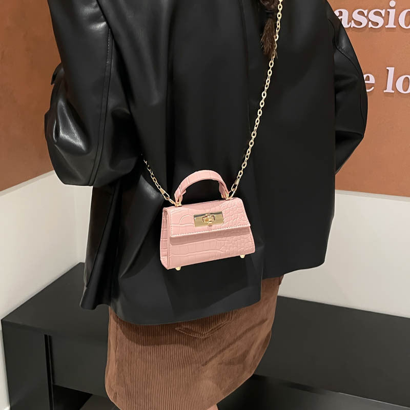 Casual small square handbag with shoulder strap in a compact structured design