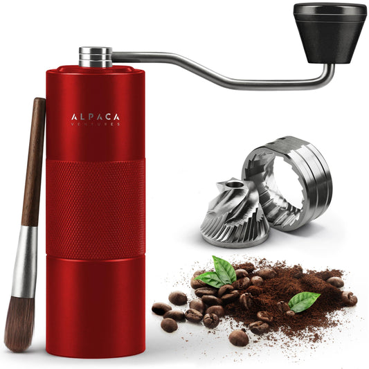 Stainless steel conical burr manual coffee grinder with red finish, compact and durable for fresh coffee brewing at home