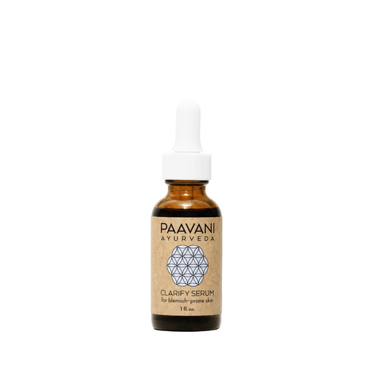 Paavani Ayurveda Clarify Serum, an Ayurvedic face oil for blemish-prone skin, showing a clear glass bottle with dropper applicator.