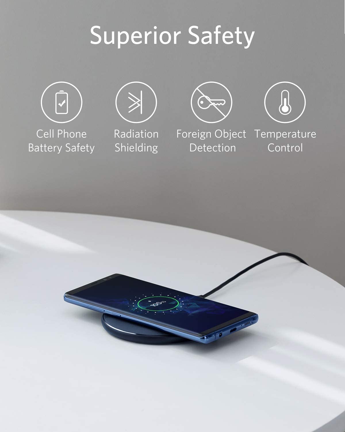 Anker 313 wireless charging pad for smartphones, sleek black design, charging surface with indicator light visible.