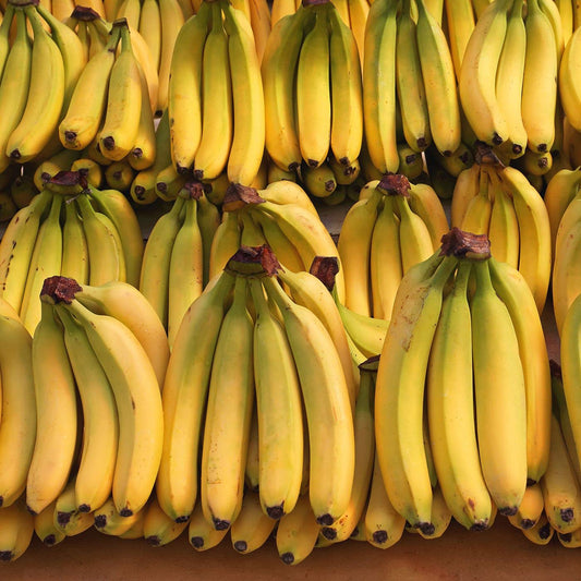Fresh bananas from the Generic brand in an 18.5 lb box, showcasing ripe yellow bananas in a wholesale produce bundle.