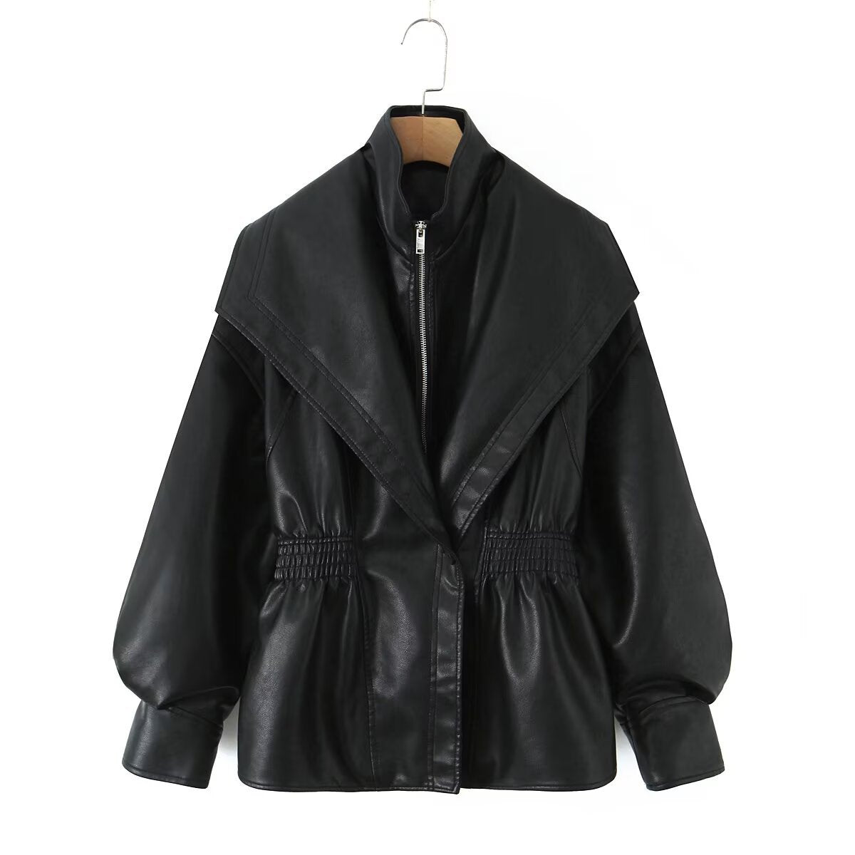Women's loose leather jacket with turn-down collar, front pockets, and relaxed fit