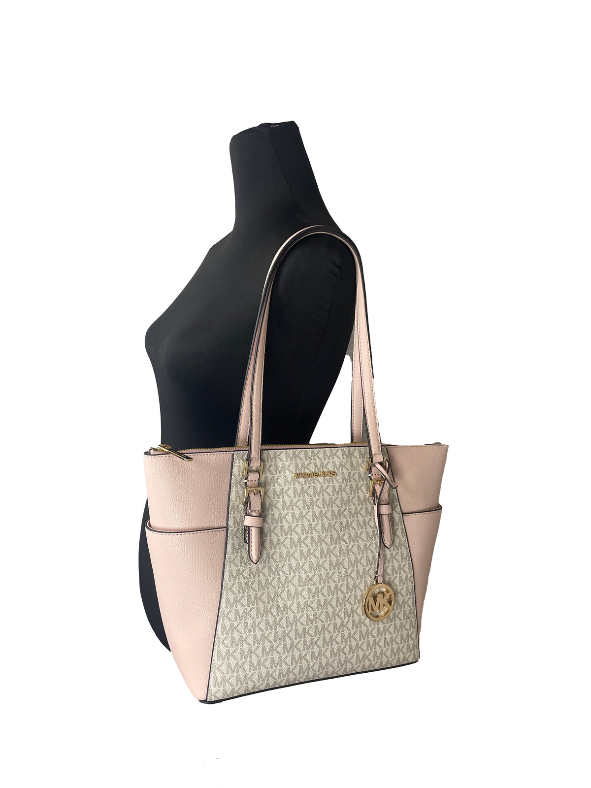 Michael Kors Charlotte Zip Leather Tote in black with gold hardware, showing its sleek design and spacious interior.