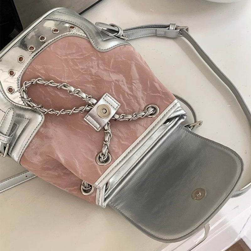 Maiden-Art commuter chain backpack for women with stylish design, featuring a chain strap, multiple compartments, and urban fashion appeal.