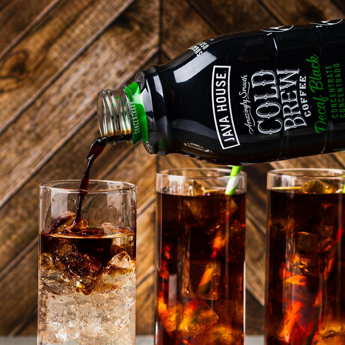 Decaf cold brew coffee concentrate from Java House, showing a glass filled with dark decaffeinated coffee.