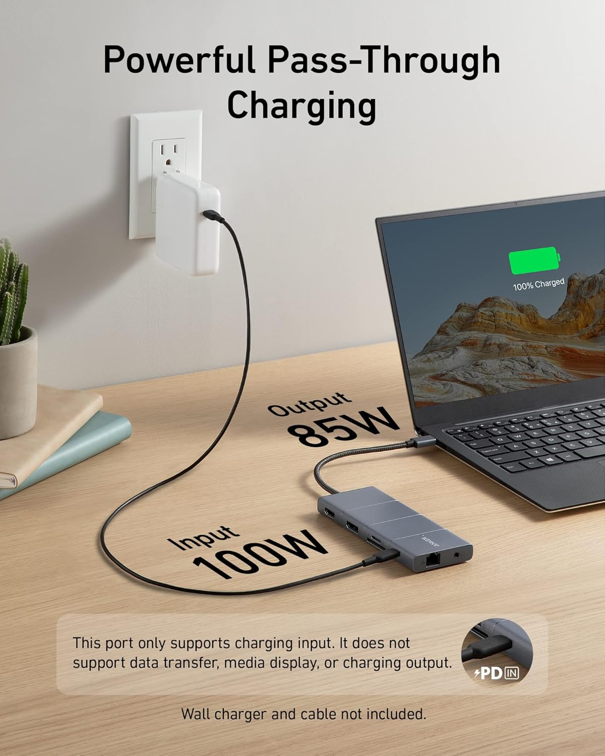 Anker 565 USB-C Hub 11-in-1 charging station with multiple ports, including USB-C, HDMI, and USB-A, connected to a laptop.