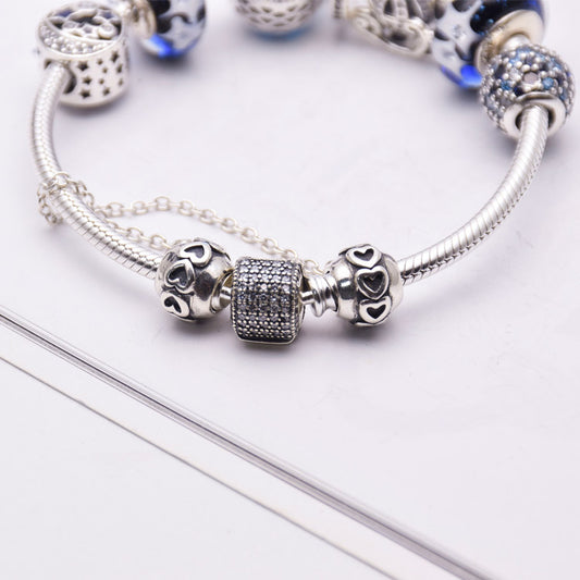 Blue glass crystal bracelet with silver 925 setting, women's jewelry featuring elegant, sparkling design.