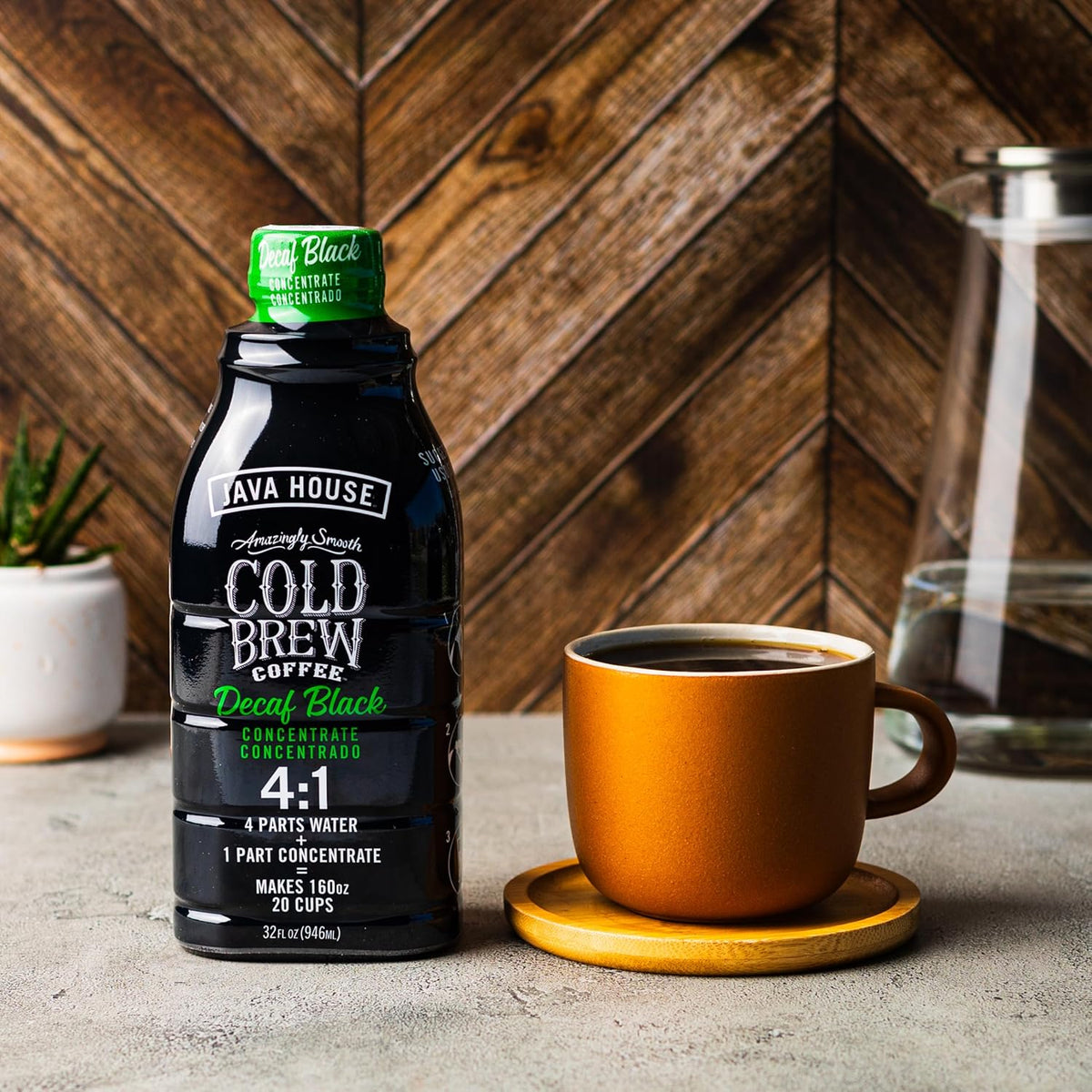 Java House Decaf Cold Brew 4:1 concentrate in a glass bottle with a black cap, ready for brewing or drinking.