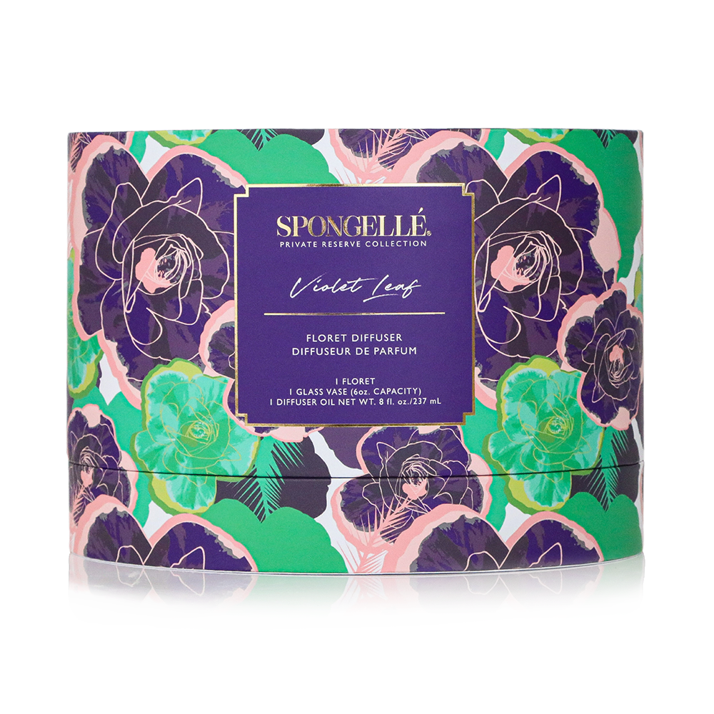 Violet Leaf private reserve diffuser by Spongellé, a home fragrance with a glass vessel and reed sticks for aromatic scent.