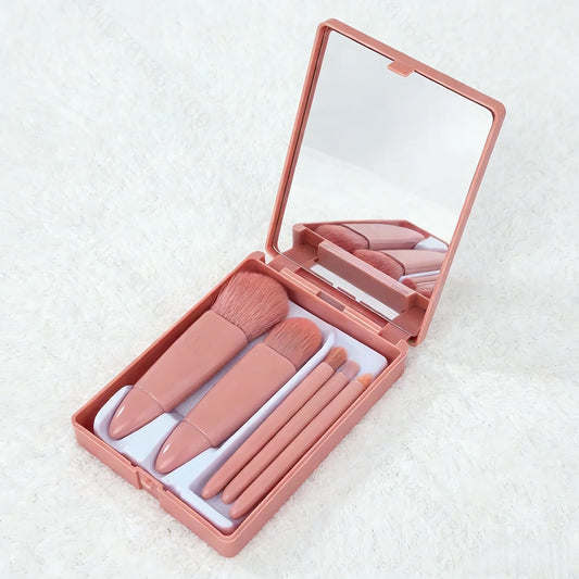 Blushimmer pink makeup brush set with five soft-bristle brushes, includes mirror compact, versatile for blush, eye makeup, and foundation.