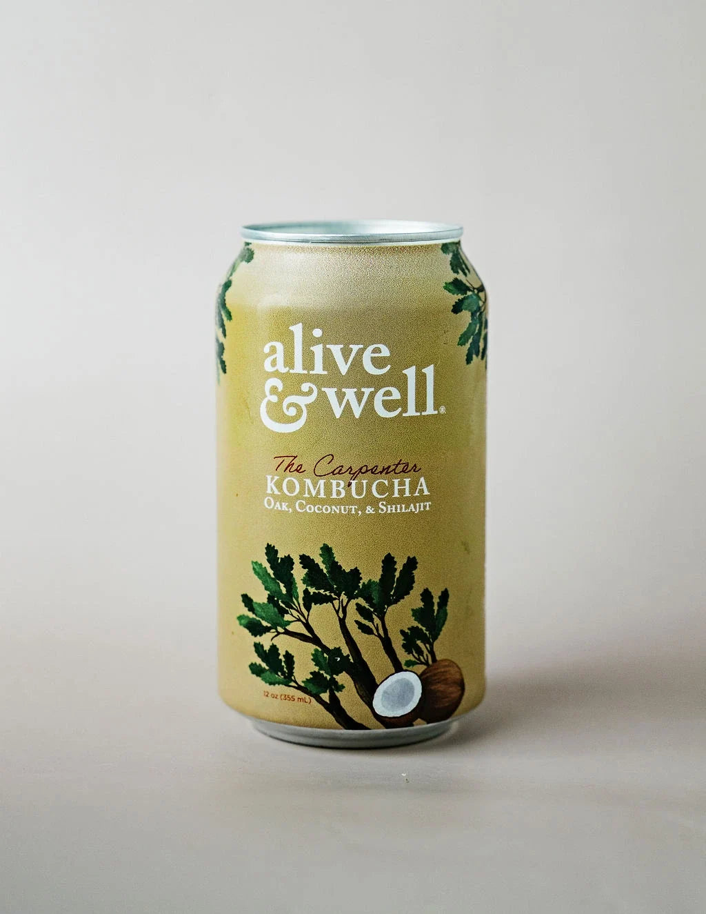 Organic Oak & Coconut Kombucha by Alive & Well in a 6-pack, showing bottles with labels featuring oak and coconut flavors.