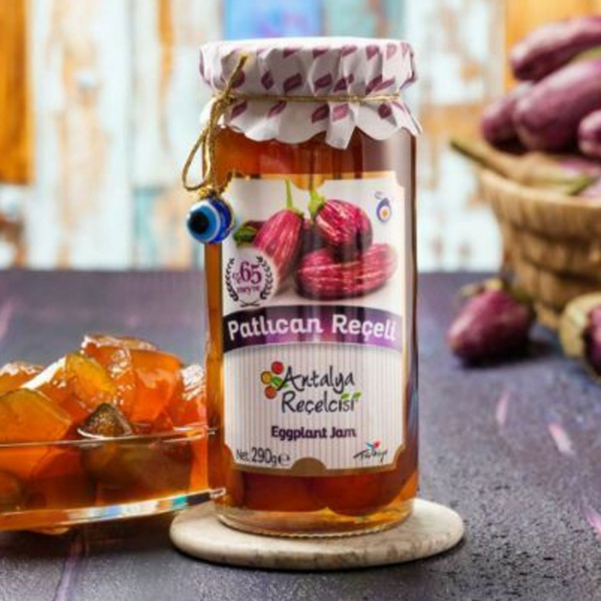 S101 Antalya Eggplant Jam in a 290g jar, showcasing the dark purple jam with a textured surface and a spoonful served on a plate.