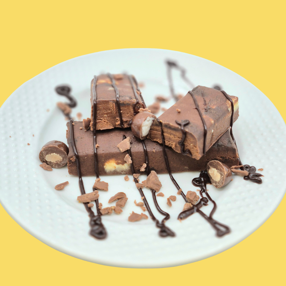 AmBari Nutrition At Last! Double Chocolate Chunk bar showing a chocolate-filled protein bar with chunks of chocolate inside.