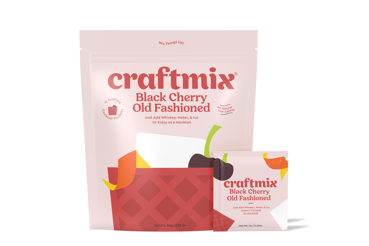 Six-pack of Craftmix Black Cherry Old Fashioned cocktail mix bottles with cherry garnish and cocktail glasses.