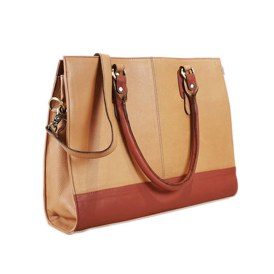 Women’s beige leather 17-inch laptop bag by GoodHides, stylish and functional with a spacious interior and sturdy handles.