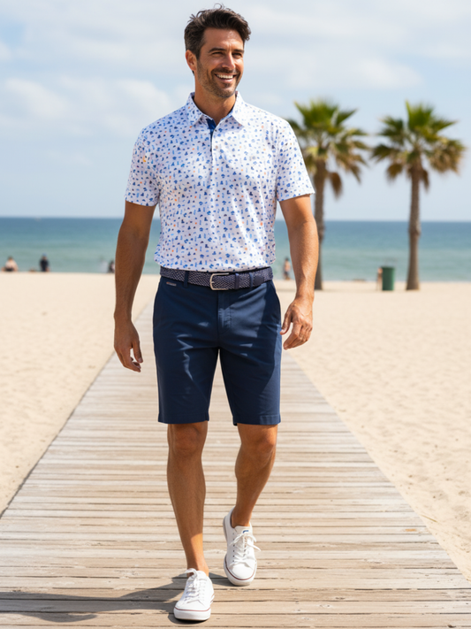 Navy Beachside Performance Polo by White Water Life with a classic collar and logo on the chest, perfect for casual beachwear.