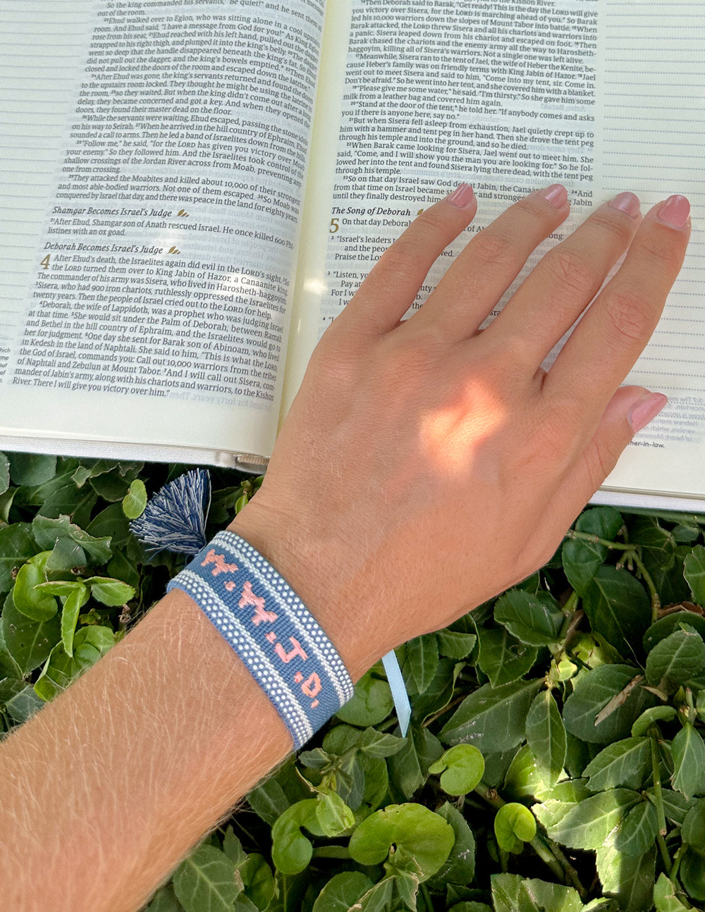 Blue WWJD embroidered bracelet wristband from Elevated Faith, featuring Christian message and blue fabric band.